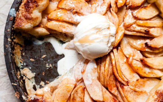 brown and white pastry on black round plate